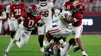 Oklahoma Sooners wide receiver Javonnie Gibson (11) is tackled by Alabama Crimson Tide wide receiver Germie Bernard (5) during the fourth quarter at Saban Field at Bryant-Denny Stadium.