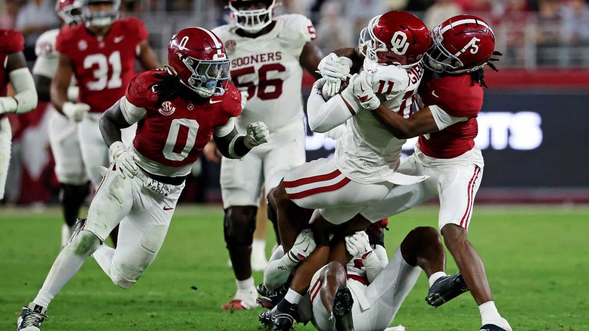 Oklahoma Sooners wide receiver Javonnie Gibson (11) is tackled by Alabama Crimson Tide wide receiver Germie Bernard (5) during the fourth quarter at Saban Field at Bryant-Denny Stadium.