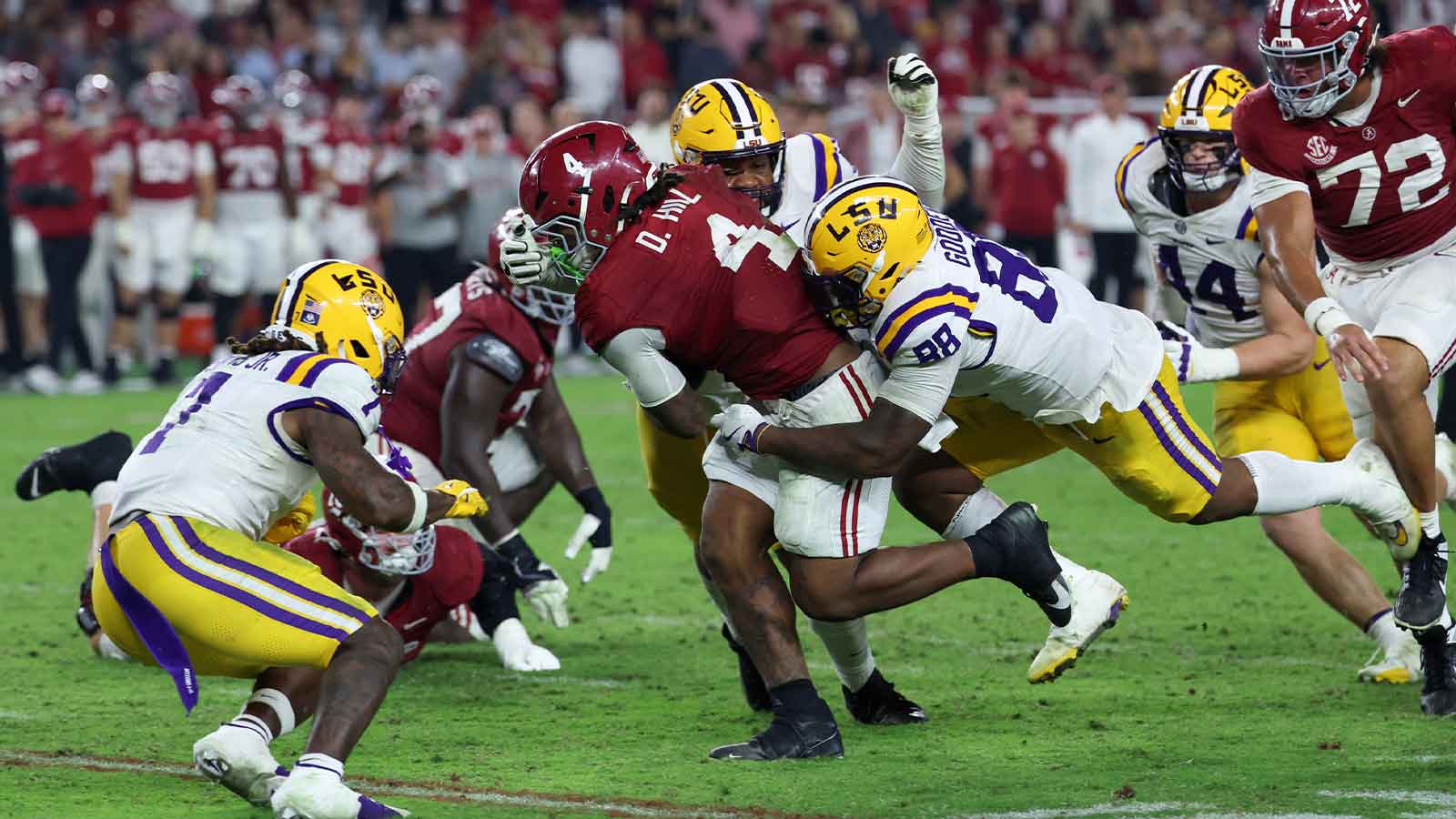 Louisiana State Tigers defensive lineman Bernard Gooden (88) tackles Alabama Crimson Tide running back Daniel Hill (4) during the fourth quarter of the game at Saban Field at Bryant-Denny Stadium.