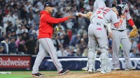 Boston Red Sox manager Alex Cora (13) makes a pitching change during the fifth inning against the New York Yankees during game two of the Wildcard round for the 2025 MLB playoffs at Yankee Stadium.