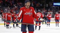 Washington Capitals left wing Alex Ovechkin (8) gestures to his son Sergei (not pictured) after the Capitals' game against the St. Louis Blues, where he scored his 900th NHL goal at Capital One Arena.