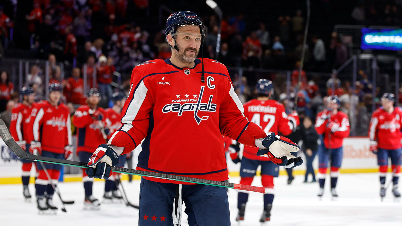 Washington Capitals left wing Alex Ovechkin (8) gestures to his son Sergei (not pictured) after the Capitals' game against the St. Louis Blues, where he scored his 900th NHL goal at Capital One Arena.