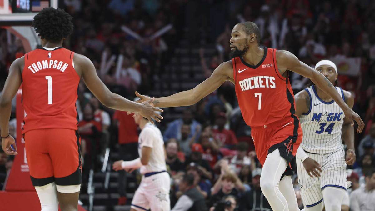 Houston Rockets guard Amen Thompson (1) and forward Kevin Durant (7) celebrate after a play during the third quarter against the Orlando Magic at Toyota Center.