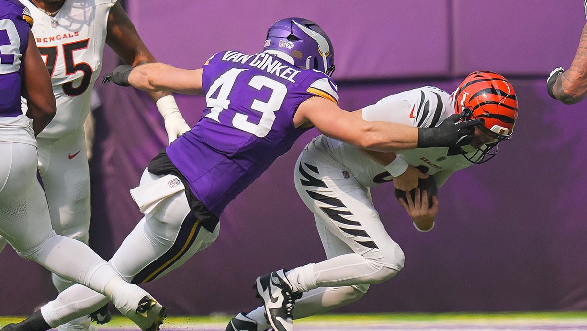 Cincinnati Bengals quarterback Jake Browning (6) is sacked by Minnesota Vikings outside linebacker Andrew van Ginkel (43) during the first half at U.S. Bank Stadium.