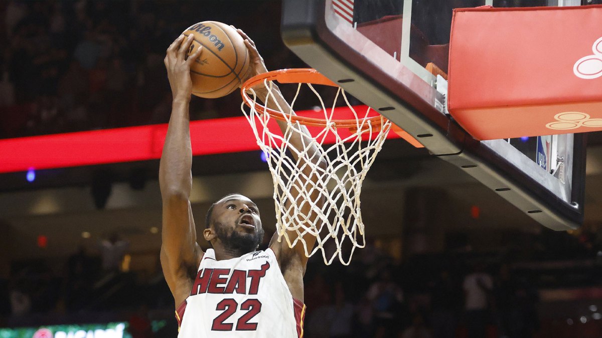 Miami Heat forward Andrew Wiggins (22) dunks against the Cleveland Cavaliers during overtime at Kaseya Center.