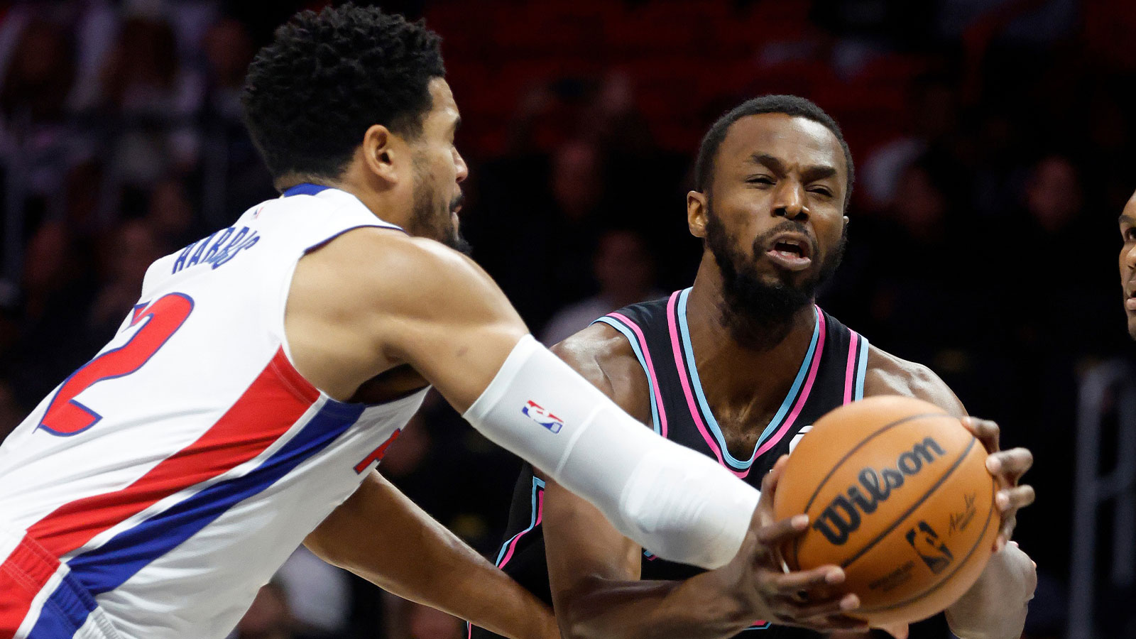 Detroit Pistons forward Tobias Harris (12) fouls Miami Heat forward Andrew Wiggins (22) during the first half at Kaseya Center. 