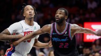 Detroit Pistons forward Ronald Holland II (5) vies for a rebound against Miami Heat forward Andrew Wiggins (22) during the second half at Kaseya Center.