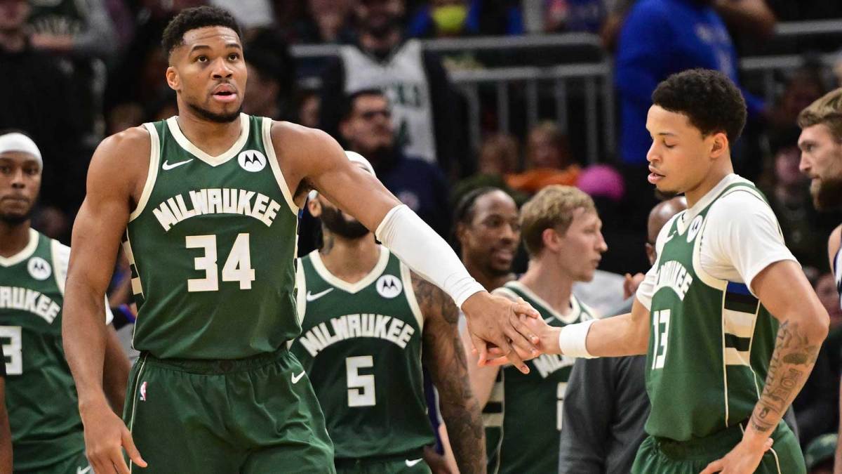 Milwaukee Bucks forward Giannis Antetokounmpo (34) reacts with guard Ryan Rollins (13) after scoring a basket in the 3rd quarter against the Sacramento Kings at Fiserv Forum.