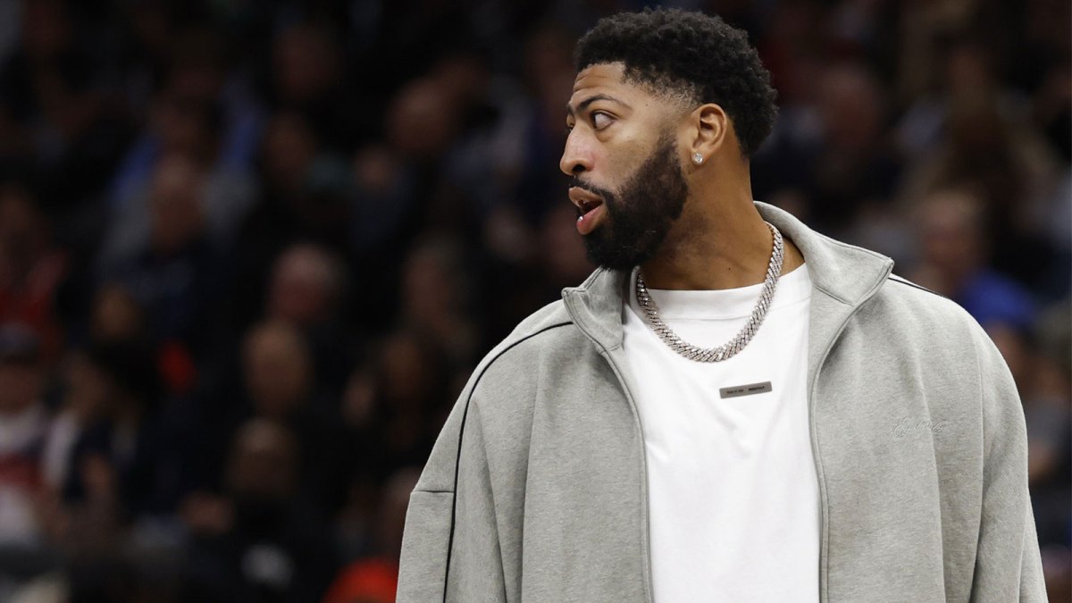 Injured Dallas Mavericks forward Anthony Davis looks on from the bench during a timeout against the Washington Wizards in the second half at Capital One Arena.