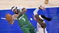 Dallas Mavericks forward Anthony Davis (3) and Oklahoma City Thunder guard Luguentz Dort (5) battle for the loose ball during the first quarter at the American Airlines Center.