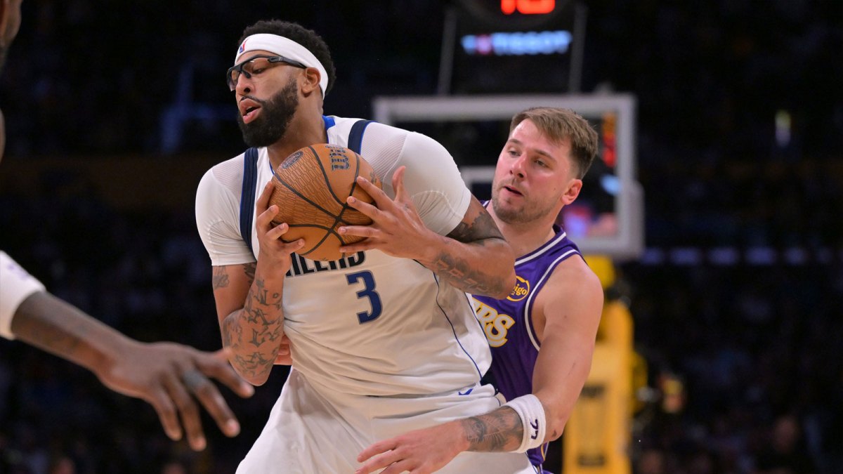 Dallas Mavericks forward Anthony Davis (3) is defended by Los Angeles Lakers guard Luka Doncic (77) as he handles the ball in the second half at Crypto.com Arena.