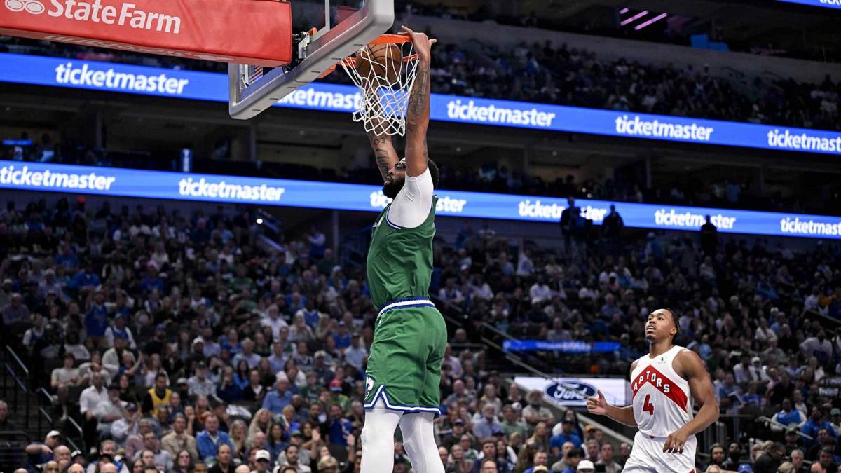 Dallas Mavericks forward Anthony Davis (3) dunks the ball as Toronto Raptors forward Scottie Barnes (4) looks on during the second half at the American Airlines Center.