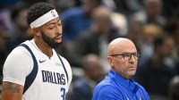 Dallas Mavericks forward Anthony Davis (3) exchanges words with Dallas Mavericks head coach Jason Kidd as Davis walks off the court during the first quarter at the American Airlines Center.