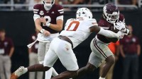 Mississippi State Bulldogs running back Davon Booth (6) runs the ball as Texas Longhorns linebacker Anthony Hill Jr. (0) makes the tackle during the third quarter at Davis Wade Stadium at Scott Field.