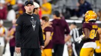 Arizona State head coach Kenny Dillingham walks the field prior to a game against Arizona at Mountain America Stadium.