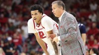 Arkansas Razorbacks forward Malique Ewin (12) talks to head coach John Calipari during the second half against the Jackson State Tigers at Bud Walton Arena. Arkansas won 115-61.