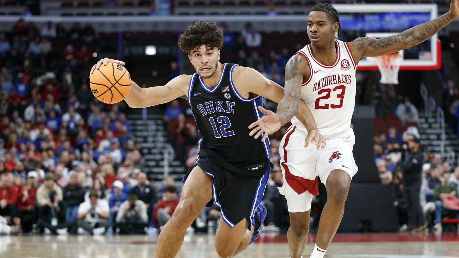 Duke Blue Devils forward Cameron Boozer (12) drives to the basket against Arkansas Razorbacks forward Nick Pringle (23) during the second half at United Center.