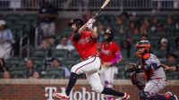 Atlanta Braves right fielder Eli White (36) hits a two-run home run against the Houston Astros in the eighth inning at Truist Park.