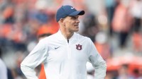 Auburn Tigers interim head coach DJ Durkin watches on during warm ups before Auburn Tigers take on Mercer Bears at Jordan-Hare Stadium in Auburn, Ala. on Saturday, Nov. 22, 2025.