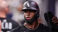 Chicago White Sox center fielder Luis Robert Jr. (88) celebrates with teammates after scoring a run against the Atlanta Braves in the eighth inning at Truist Park. Mandatory Credit: Brett Davis-Imagn Images
