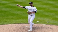 Colorado Rockies relief pitcher Austin Nola (20) delivers a pitch in the ninth inning against the Toronto Blue Jays at Coors Field.