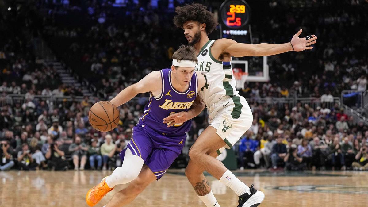 Los Angeles Lakers guard Austin Reaves (15) drives towards the basket against Milwaukee Bucks guard Andre Jackson Jr. (44) during the fourth quarter at Fiserv Forum.