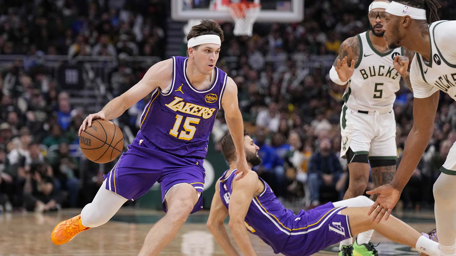 Los Angeles Lakers guard Austin Reaves (15) drives towards the basket during the fourth quarter against the Milwaukee Bucks at Fiserv Forum.