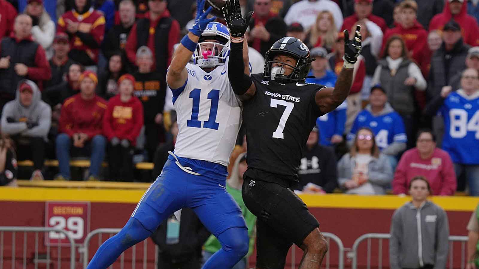 BYU Cougars wide receiver Parker Kingston (11) catches a pass for a touchdown as Iowa State Cyclones defensive back Tre Bell (7) during the fourth quarter at Jack Trice Stadium on Oct. 25, 2025, in Ames, Iowa.