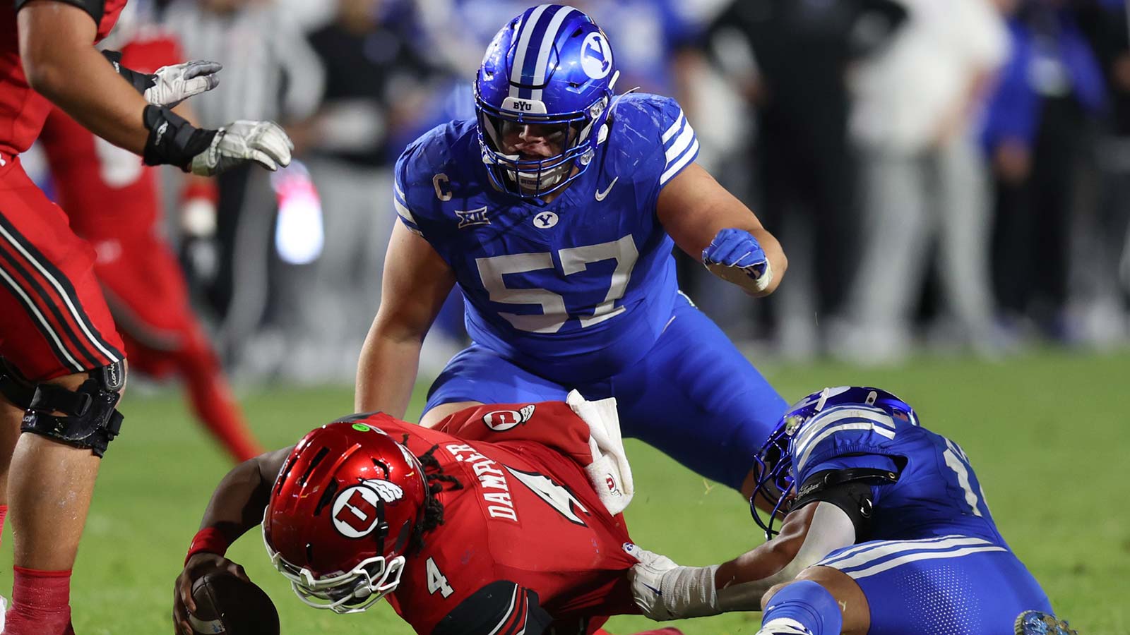 Utah Utes quarterback Devon Dampier (4) is sacked by BYU Cougars linebacker Jack Kelly (17) during the second half at LaVell Edwards Stadium.