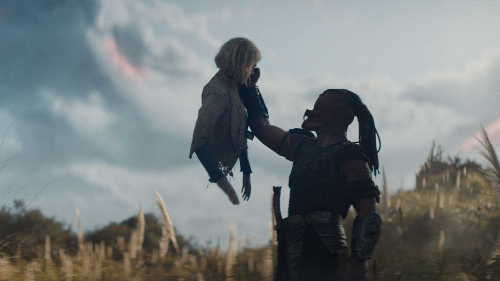 Elle Fanning and Dimitrius Schuster-Koloamatangi in 20th Century Studios' new movie, Predator: Badlands, from director Dan Trachtenberg.