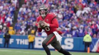 Tampa Bay Buccaneers quarterback Baker Mayfield runs laterally to find an open receiver during first half action against the Tampa Bay Buccaneers on Nov 16, 2025 at Highmark Stadium in Orchard Park.