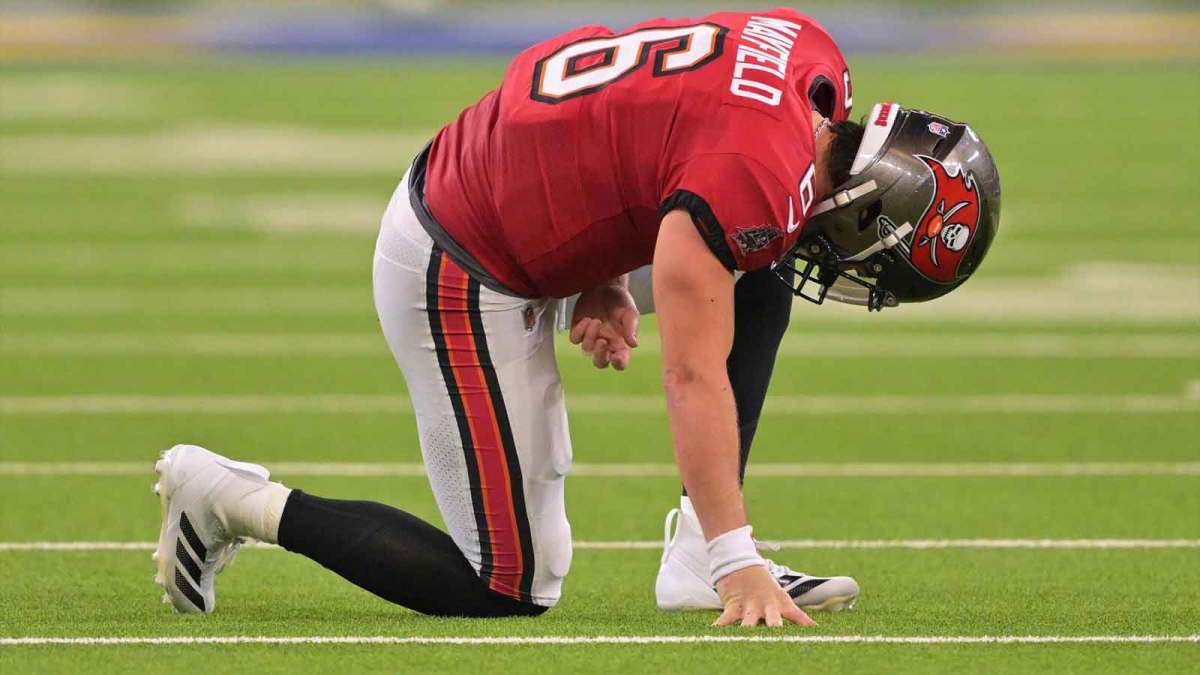 Tampa Bay Buccaneers quarterback Baker Mayfield (6) kneels on the field with an apparent injury against the Los Angeles Rams during the second quarter at SoFi Stadium. Mandatory Credit: Jayne Kamin-Oncea-Imagn Images