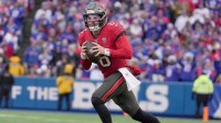 Tampa Bay Buccaneers quarterback Baker Mayfield runs laterally to find an open receiver during first half action against the Tampa Bay Buccaneers on Nov 16, 2025 at Highmark Stadium in Orchard Park.