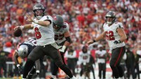 Tampa Bay Buccaneers quarterback Baker Mayfield (6) throws downfield during the third quarter against the New England Patriots at Raymond James Stadium.