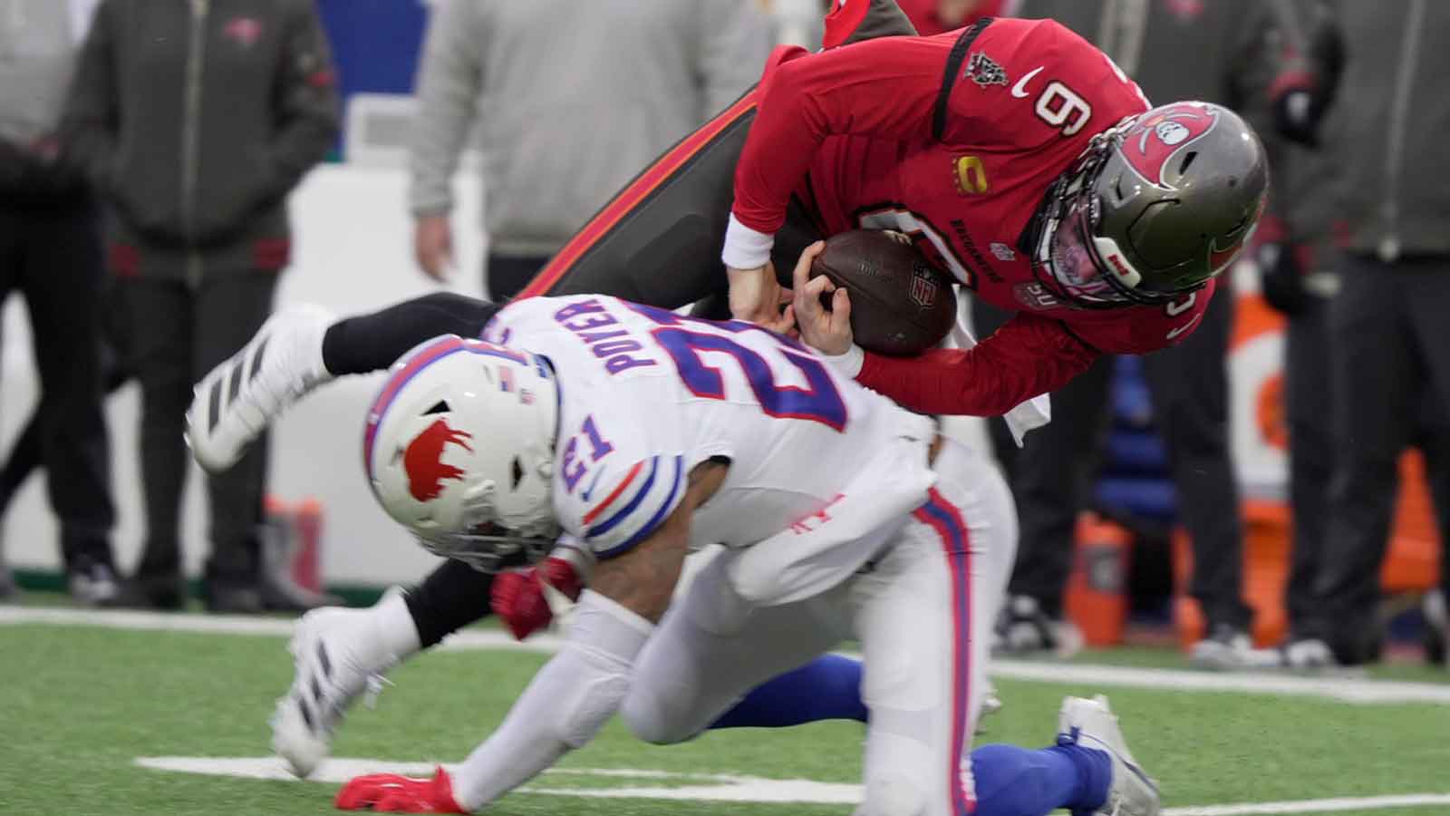 Buffalo Bills safety Jordan Poyer trips up Tampa Bay Buccaneers quarterback Baker Mayfield who was carrying the ball during first half action against the Tampa Bay Buccaneers on Nov 16, 2025 at Highmark Stadium in Orchard Park.