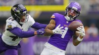 Minnesota Vikings wide receiver Jalen Nailor (1) catches a pass against Baltimore Ravens cornerback Marlon Humphrey (44) in the first quarter at U.S. Bank Stadium.