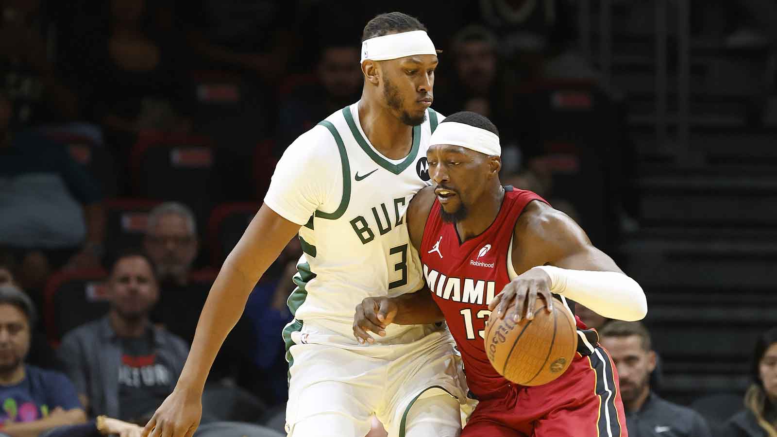 Milwaukee Bucks center Myles Turner (3) defends Miami Heat center Bam Adebayo (13) during the first half of an NBA Cup game at Kaseya Center.