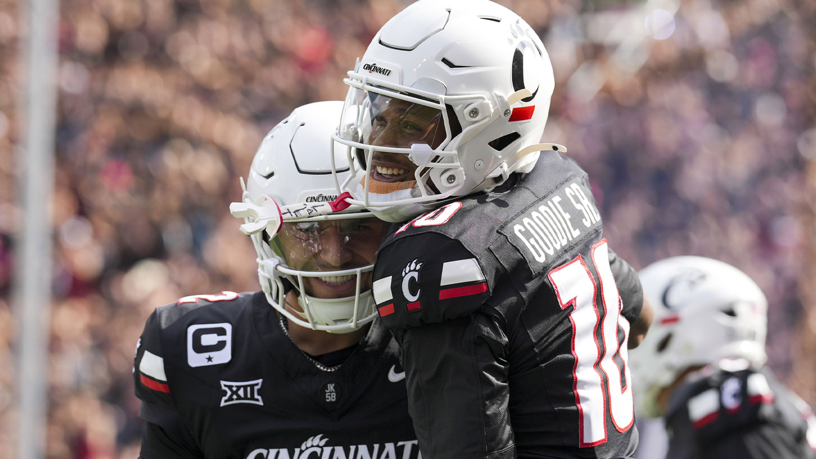 Cincinnati Bearcats wide receiver Caleb Goodie (10) celebrates with quarterback Brendan Sorsby (2) after scoring a touchdown against the Northwestern State Demons in the first half at Nippert Stadium.