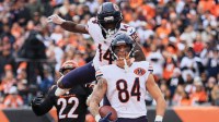 Nov 2, 2025; Cincinnati, Ohio, USA; Chicago Bears tight end Colston Loveland (84) celebrates with wide receiver Olamide Zaccheaus (14) after catching a 5-yard touchdown pass thrown by quarterback Caleb Williams (not pictured) against Cincinnati Bengals safety Geno Stone (22) during the third quarter at Paycor Stadium. Mandatory Credit: Katie Stratman-Imagn Images