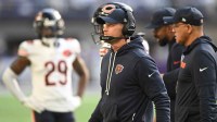 Chicago Bears head coach Ben Johnson walks the sideline during the second quarter against the Minnesota Vikings at U.S. Bank Stadium.