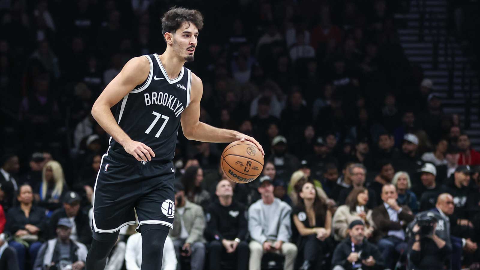 Brooklyn Nets guard Ben Saraf (77) brings the ball up court in the first quarter against the Cleveland Cavaliers at Barclays Center.