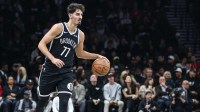 Oct 24, 2025; Brooklyn, New York, USA; Brooklyn Nets guard Ben Saraf (77) brings the ball up court in the first quarter against the Cleveland Cavaliers at Barclays Center. Mandatory Credit: Wendell Cruz-Imagn Images
