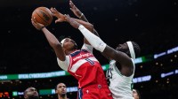 Boston Celtics center Neemias Queta (88) defends against Washington Wizards guard Bilal Coulibaly (0) in the second quarter at TD Garden.