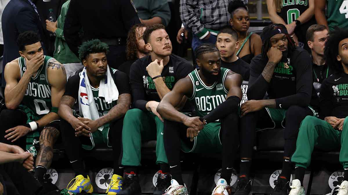 Celtics forward Jayson Tatum (0) and guard Marcus Smart (36) and forward Blake Griffin (91) and guard Jaylen Brown (7) react from the bench during the fourth quarter against the Miami Heat in game seven of the Eastern Conference Finals for the 2023 NBA playoffs at TD Garden