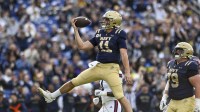 Navy Midshipmen quarterback Blake Horvath (11) reacts after scoring a second quarter touchdown against the Florida Atlantic Owls at Navy-Marine Corps Memorial Stadium.