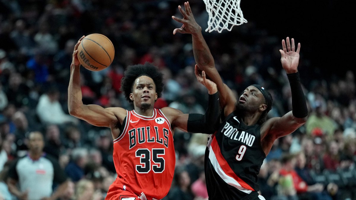 Chicago Bulls forward Isaac Okoro (35) goes up for a shot under pressure from Portland Trail Blazers forward Jerami Grant (9) during the second half at Moda Center.