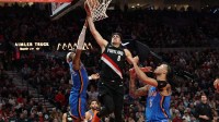 Portland Trail Blazers forward Deni Avdija (8) dunks the ball over Oklahoma City Thunder guard Shai Gilgeous-Alexander (2) and Thunder’s forward Jaylin Williams (6) during the second half at Moda Center