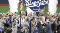 The Los Angeles Dodgers celebrate on the podium after defeating the Toronto Blue Jays in game seven of the 2025 MLB World Series at Rogers Centre.