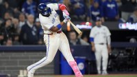Toronto Blue Jays first baseman Vladimir Guerrero Jr. (27) hits a double against the Los Angeles Dodgers in the eleventh inning during game seven of the 2025 MLB World Series at Rogers Centre.