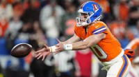 Denver Broncos quarterback Bo Nix (10) pitches the ball against the Las Vegas Raiders during the first half at Empower Field at Mile High.